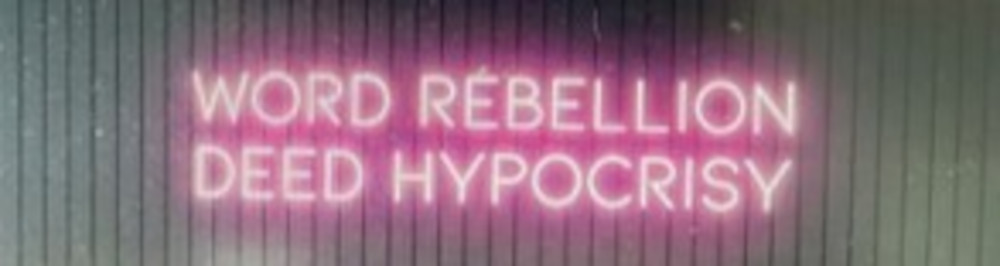 Alexandra Bell neon art exploring hypocrisy